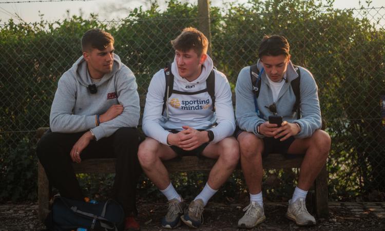 Photo of Ben sitting with his friends