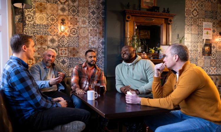 Group of men in coffee shop