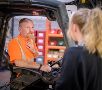 People working in a warehouse or a factory