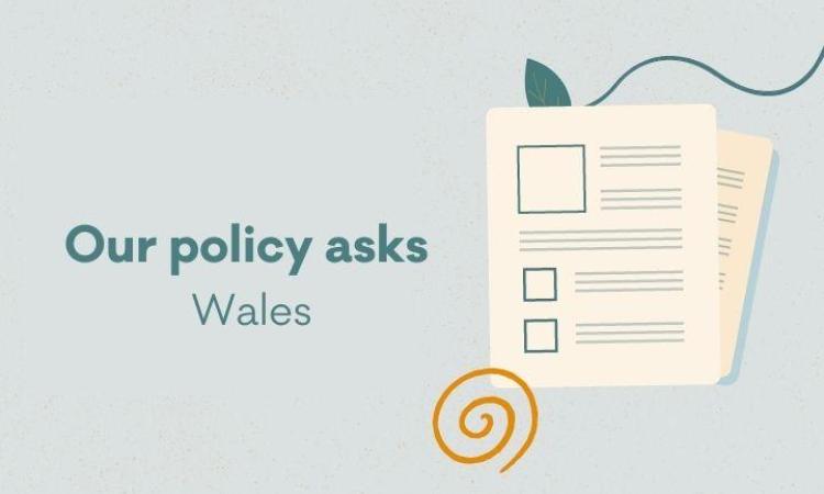 Graphic of some paper and the words 'Our policy asks. Wales'