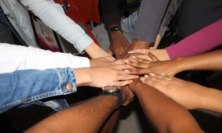 Hands coming together
