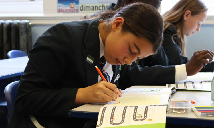 School girl writing